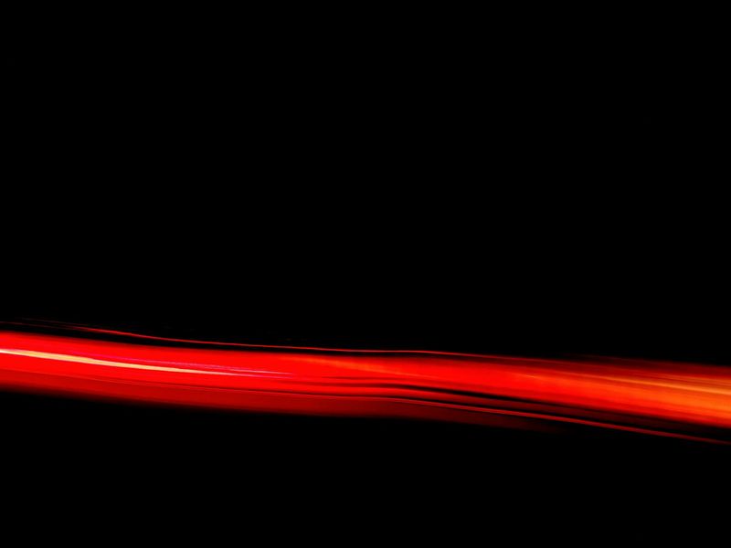 Abstract glowing lines representing smooth motion flow and energy.