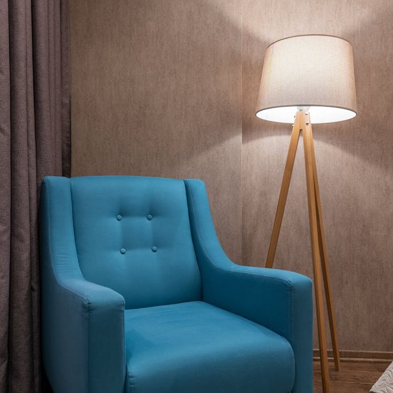 Minimalist room with soft lighting and comfortable chair.